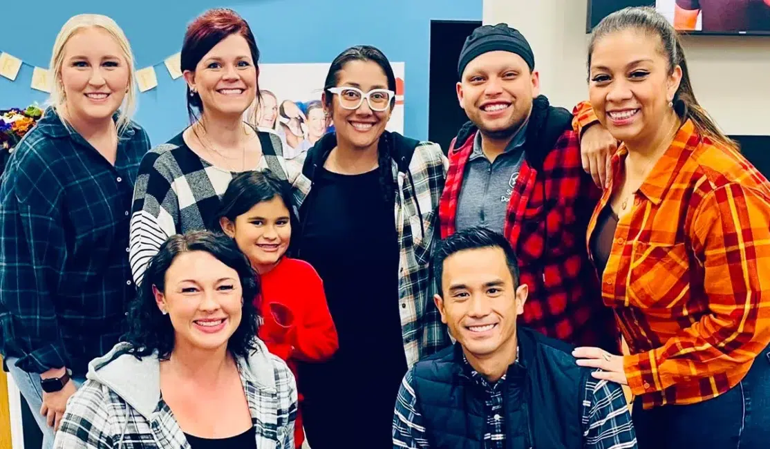 Dr. Santos and team members wearing flannel in clinic